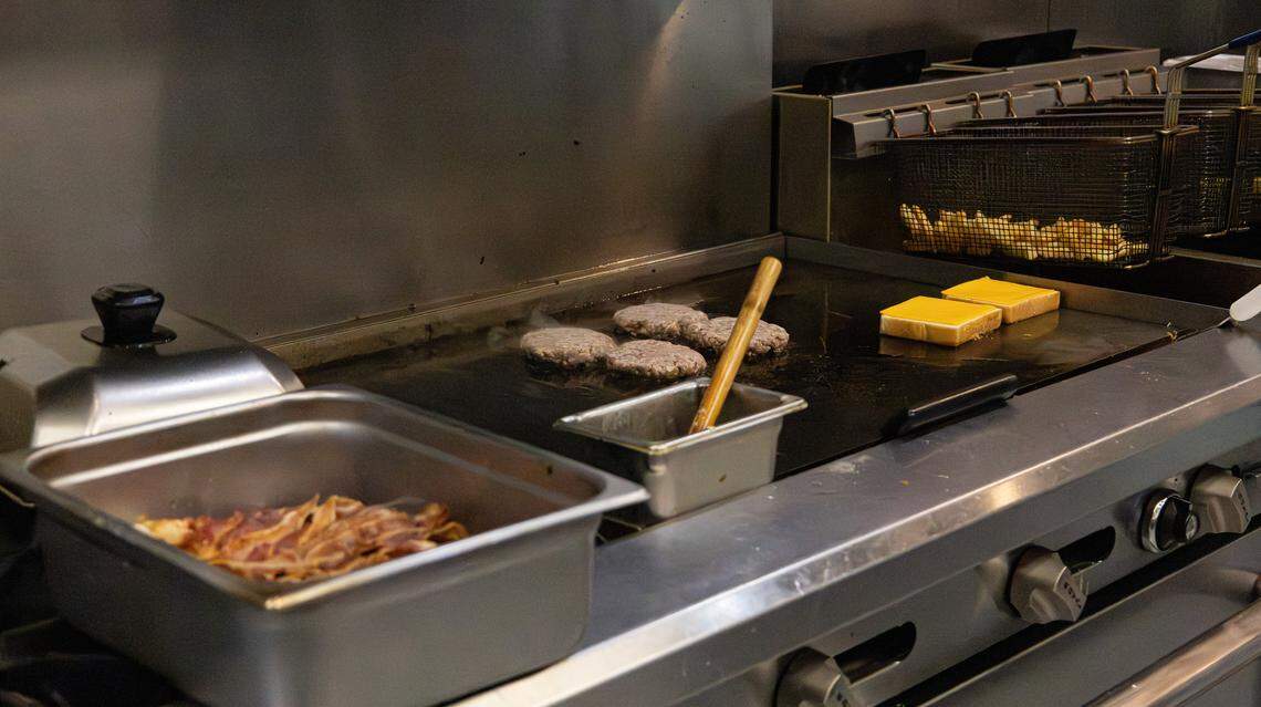 Cheeseburgers with bacon and crispy fries made to order at Shelby’s Diner on Nov. 19, 2025, in Frankfort, Ky. 