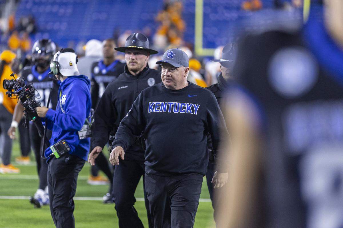 Kentucky head coach Mark Stoops walks off the field following Saturday’s 56-34 loss to Tennessee at Kroger Field.