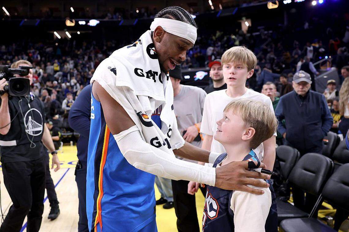 Shai Gilgeous-Alexander (2) of the Oklahoma City Thunder signed autographs after a game against the Golden State Warriors in January. 