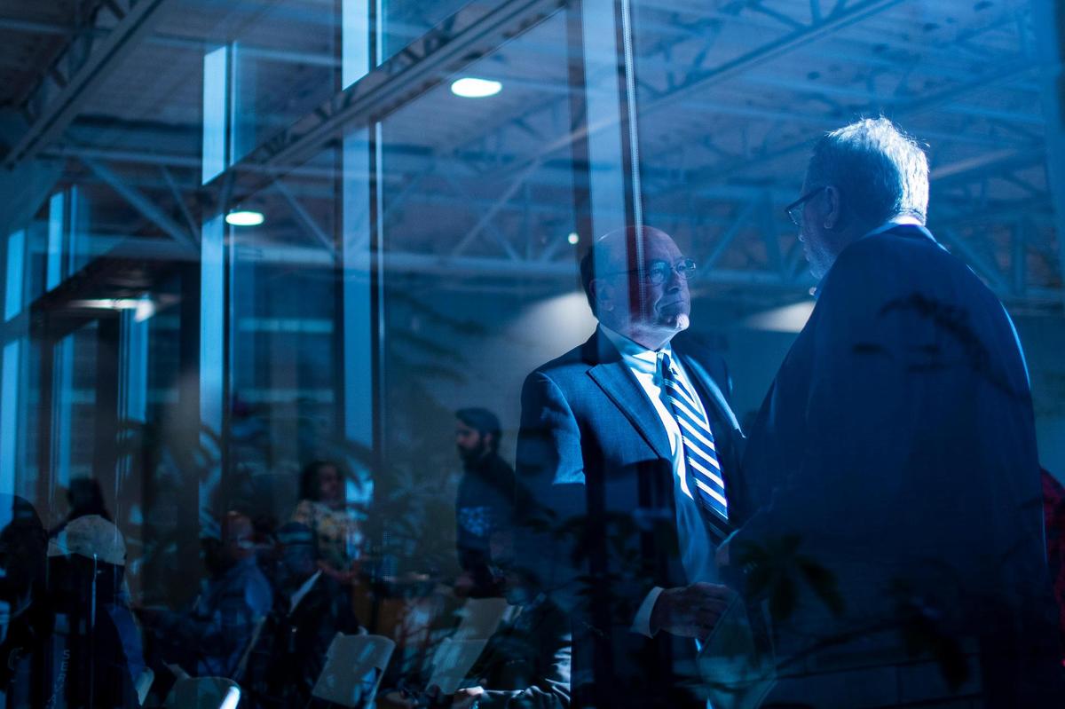 Incumbent Fayette County Attorney Larry Roberts shakes hands and greets attendees for a forum for mayoral and county attorney candidates at the Lyric Theatre in Lexington, Ky., Thursday, April 21, 2022.