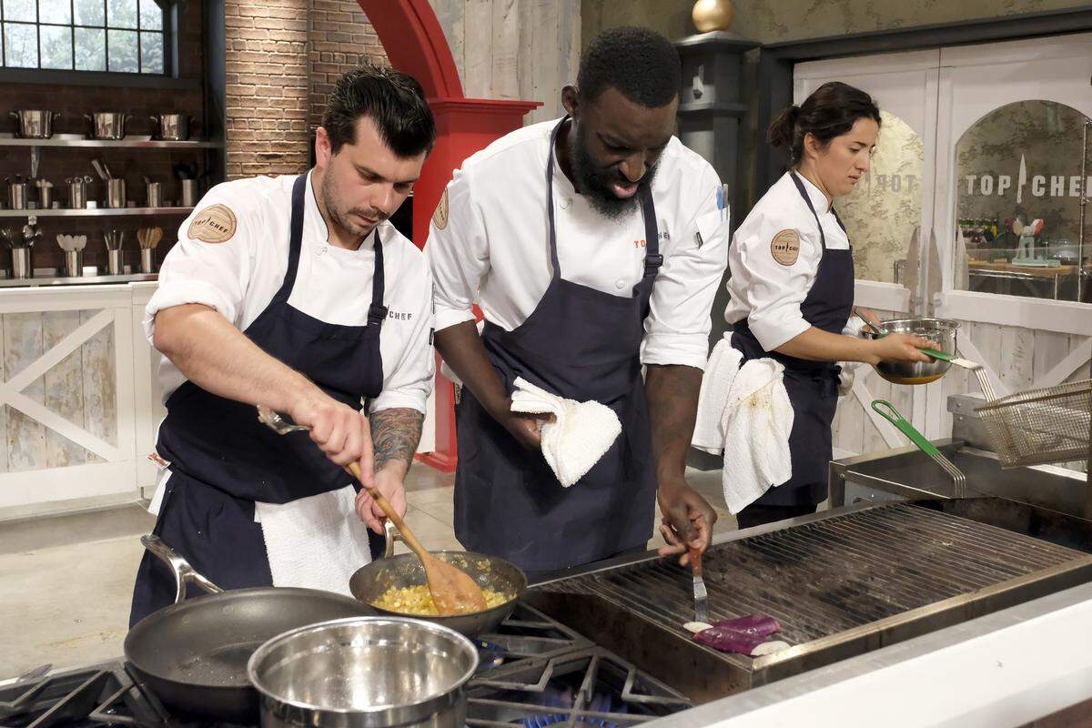 In the Quickfire, Eddie Konrad, left, beats out chefs Eric Adjepong and Michelle Minori for a huge advantage.