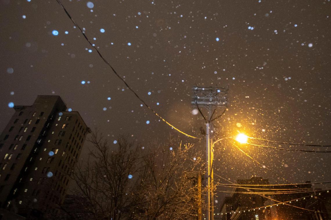 A light snow falls in downtown Lexington, Ky., on Tuesday, Feb. 16, 2021.