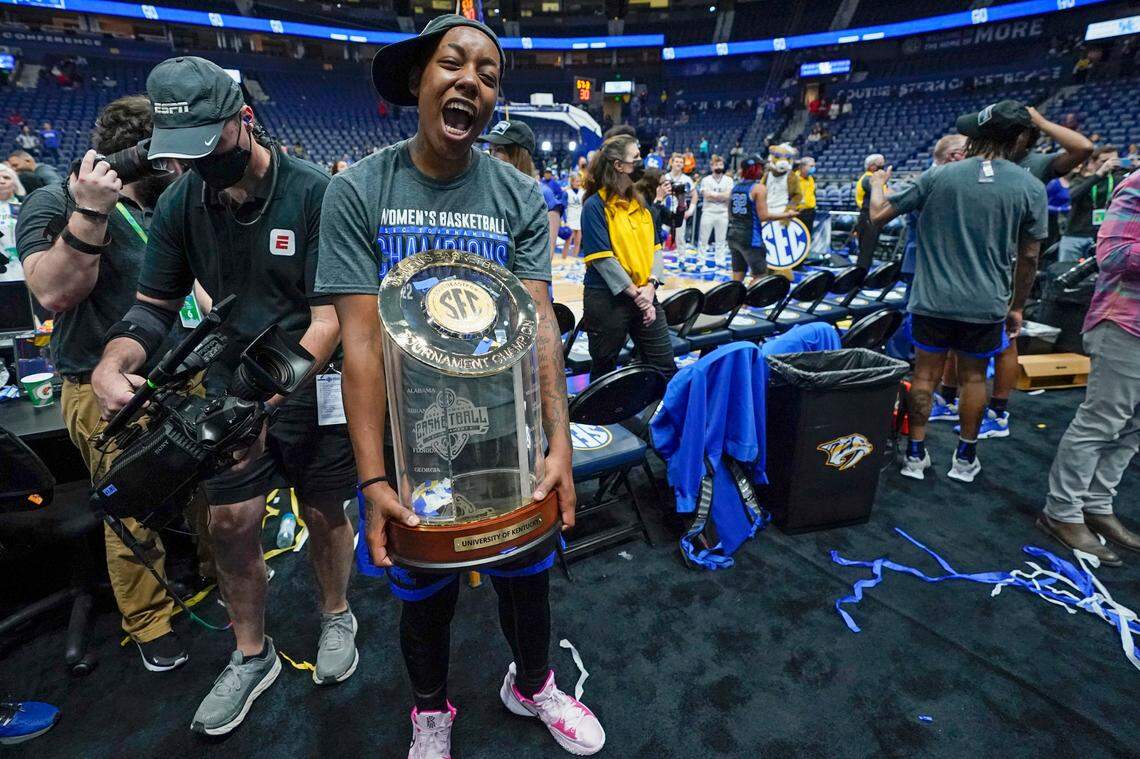 Dre’una Edwards carries the trophy after Kentucky beat South Carolina in the Southeastern Conference Tournament championship game. Edwards hit the winning shot for Kentucky. “I just kept telling my team it ain’t over, it ain’t over. … I had to do it for my team.”