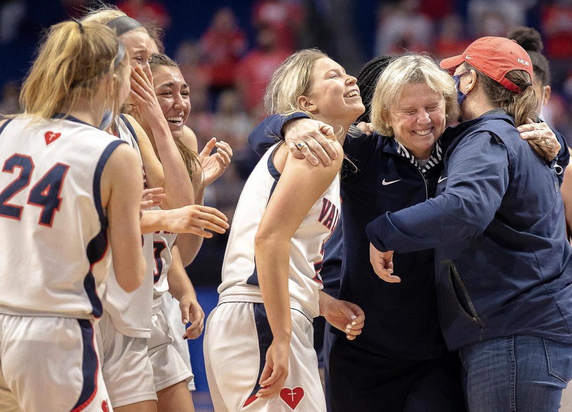 Sacred Heart’s head coach Donna Moir celebrates with her players after Sacred Heart defeated Anderson County during a semifinal game at the KHSAA Girls’ Sweet 16 at Rupp Arena in Lexington, Ky., on Saturday, April 10, 2021.