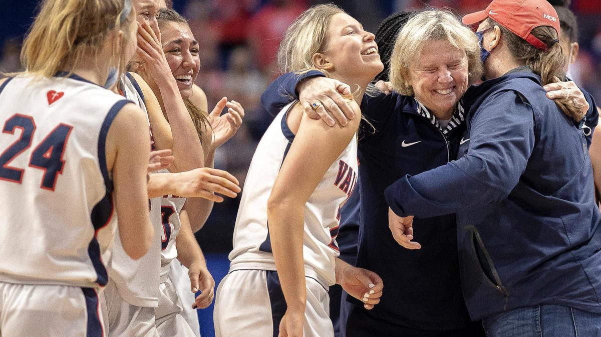 Sacred Heart’s head coach Donna Moir celebrates with her players after Sacred Heart defeated Anderson County during a semifinal game at the KHSAA Girls’ Sweet 16 at Rupp Arena in Lexington, Ky., on Saturday, April 10, 2021.