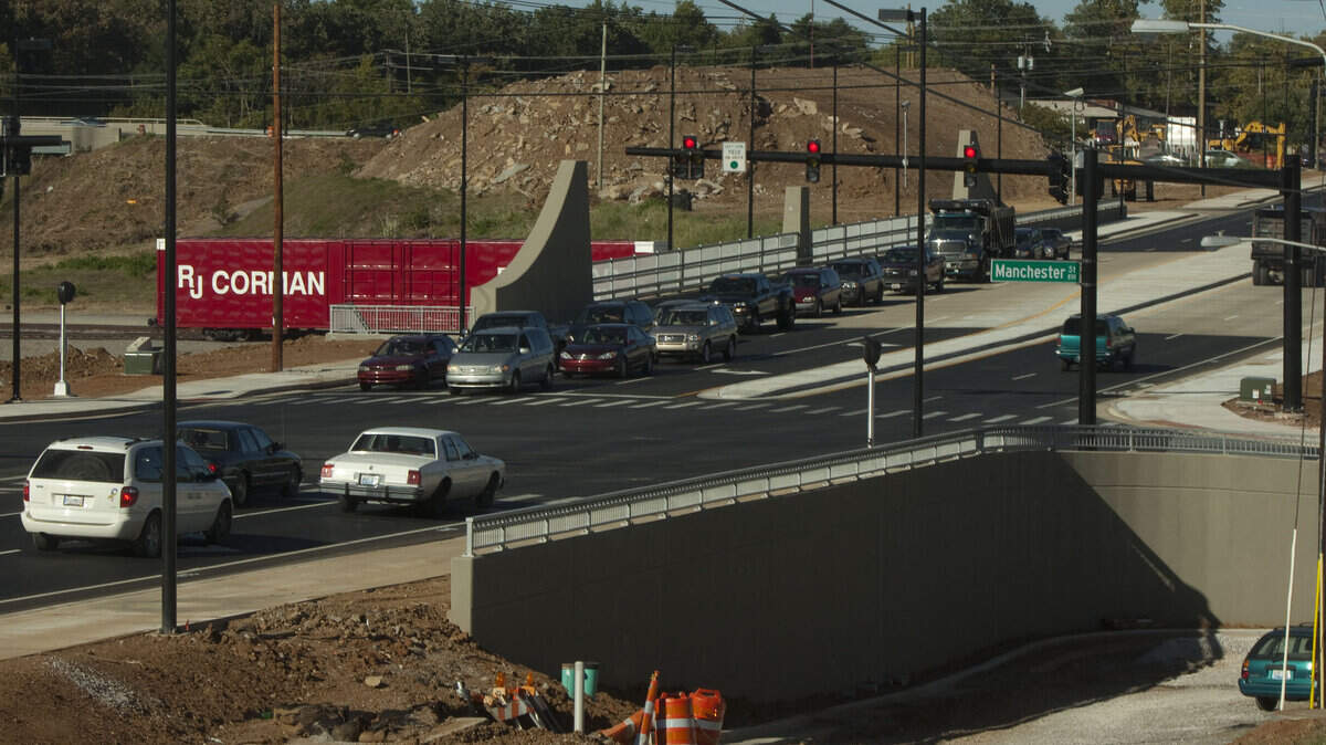 Officials held a ceremony Wednesday to officially open Oliver Lewis Way, which connects West Main Street and Versailles Road. It's unlikely all the grading work will be finished before WEG.  