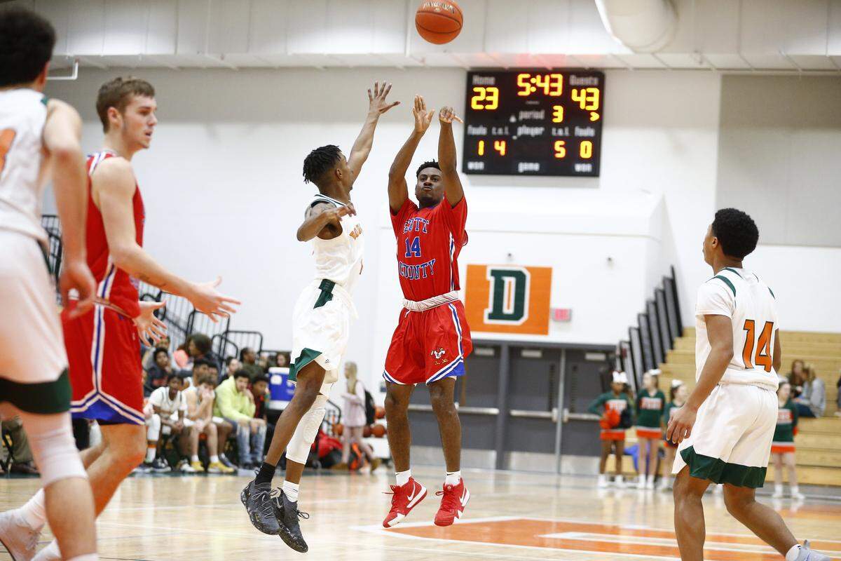 “I know I’ve got to play my defense, cause that’s my main objective,” said Scott County’s Glenn Covington (14). “But, I mean, if my shots are going in, I’m gonna shoot.”