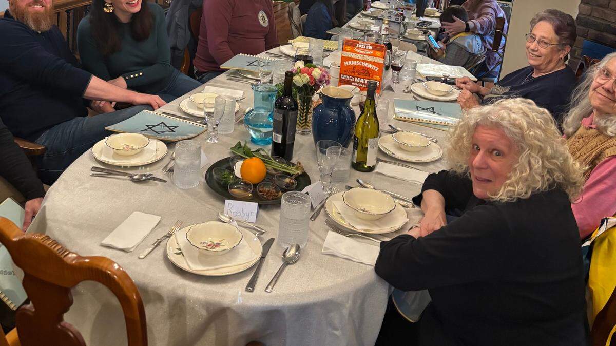 Passover seder at Honi Goldman’s daughter house with various grandmothers’ and great grandmother’s plate settings.