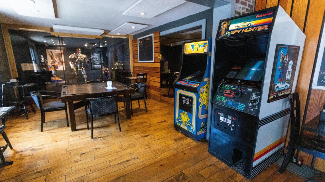 Arcade games and several comic book villain posters and sculptures, including a life-sized replica of the cyborg from “The Terminator,” are placed throughout Villainous tabletop gaming pub on Jefferson Street.