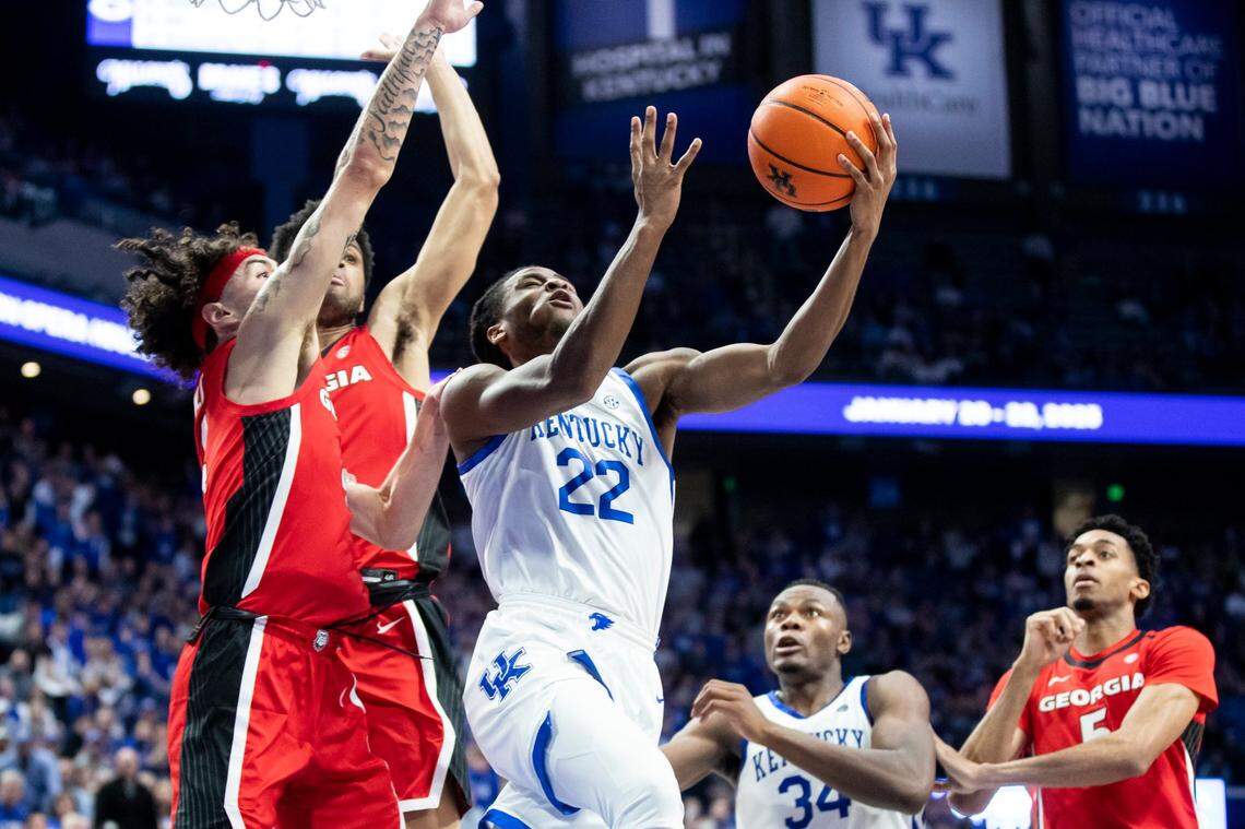Kentucky’s Cason Wallace (22) drives to the basket against Georgia’s Jusaun Holt (4) during Tuesday’s game at Rupp Arena.