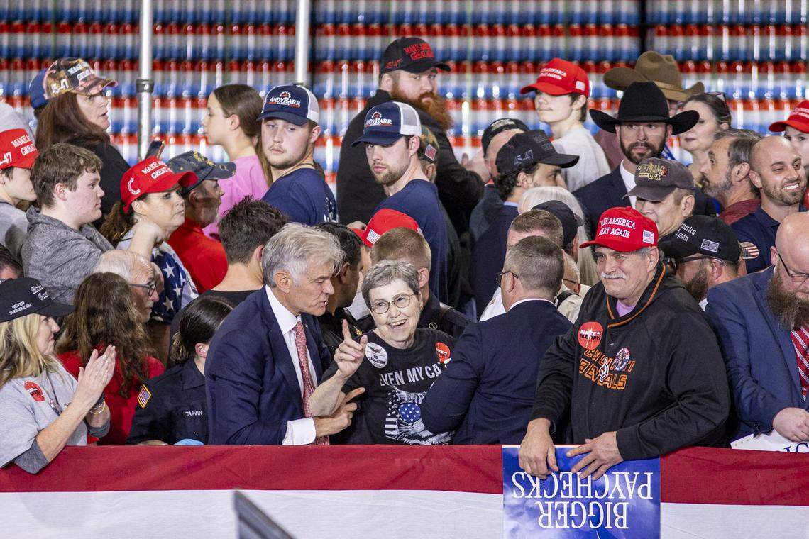 Dr. Mehmet Oz helps a woman who passed out during President Donald Trump’s visit to Verst Logistics in Hebron, Kentucky, on Wednesday, March 11, 2026.