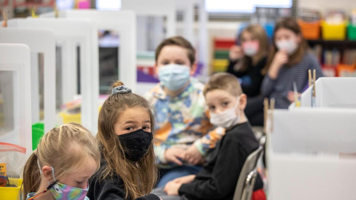 Students in Dani Heller’s second grade class look to their teacher at Veterans Park Elementary School in Lexington, Ky., on Monday, Feb. 22, 2021. Monday was the first day of in-person classes this school year for kindergarten to second grade students at Fayette County Public Schools.