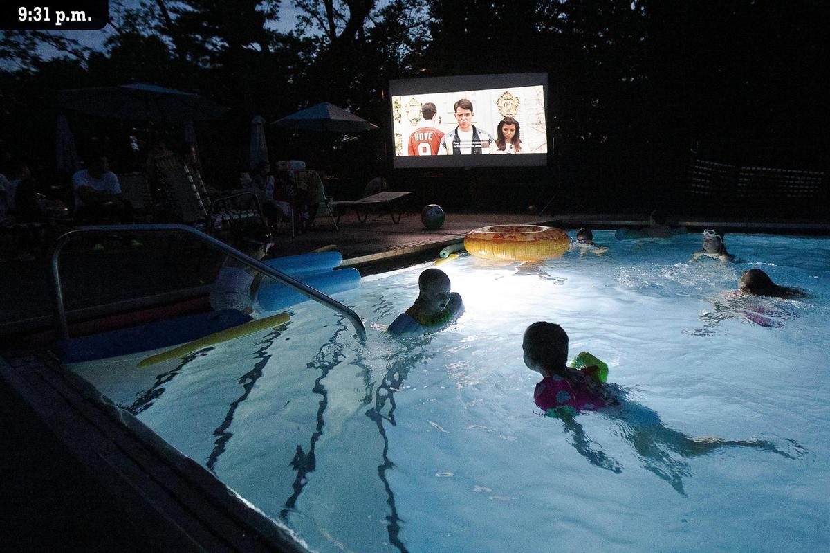 Kids swim Friday, July 9 during a family dive-in movie night at the Lexington Polo Club. The 1986 comedy “Ferris Bueller’s Day Off” was shown as members swam and lounged around the pool with popcorn, popsicles and candy. The club opened in 1967 on the Waller Squires Estate, just off Richmond Road, south of Man o’War Boulevard. It is a private, member-owned pool and tennis club with membership capped at 80. There is no maintenance or cleaning staff so members fill that role. Officer Greg Merritt said there is now a waiting list to join because of the demand for pools due to the COVID pandemic.