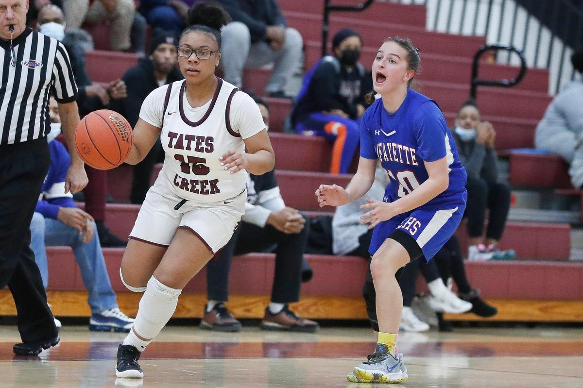 Tates Creek’s Alisce Lyvers (15) dribbles past Lafayette’s Catherine Jacobs during Friday’s game. The Commodores won 55-44.