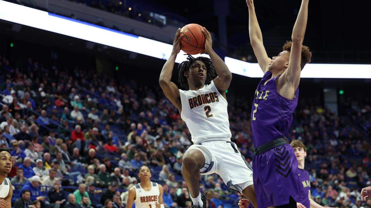 Aveion Chenault put up a shot during Friday night’s Frederick Douglass win over Male. He made nine of 10 free throw attempts and scored 13 points with five rebounds and four assists.
