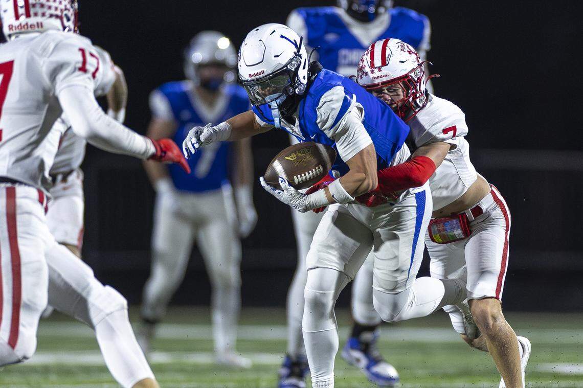 Lexington Christian's Tyler King (1) attempts to break a tackle by Belfry's James Ferrell (78) during their state semifinals game at LCA on Friday.