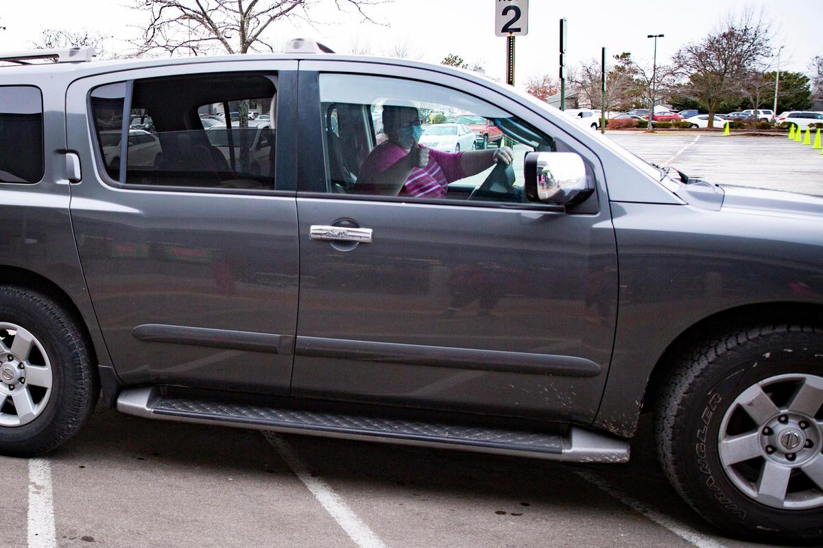 Adrianna Howard gave a thumbs up after receiving her gifts during the Salvation Army Angel Tree gift pickup.