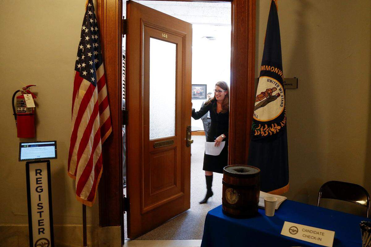 Secretary of State Alison Lundergan Grimes shuts the officially closes the door of her office after the 4 p.m. deadline passes to file for office in the 2018 primary at the Kentucky State Capitol in Frankfort, Ky., on Tuesday, January 30, 2018.