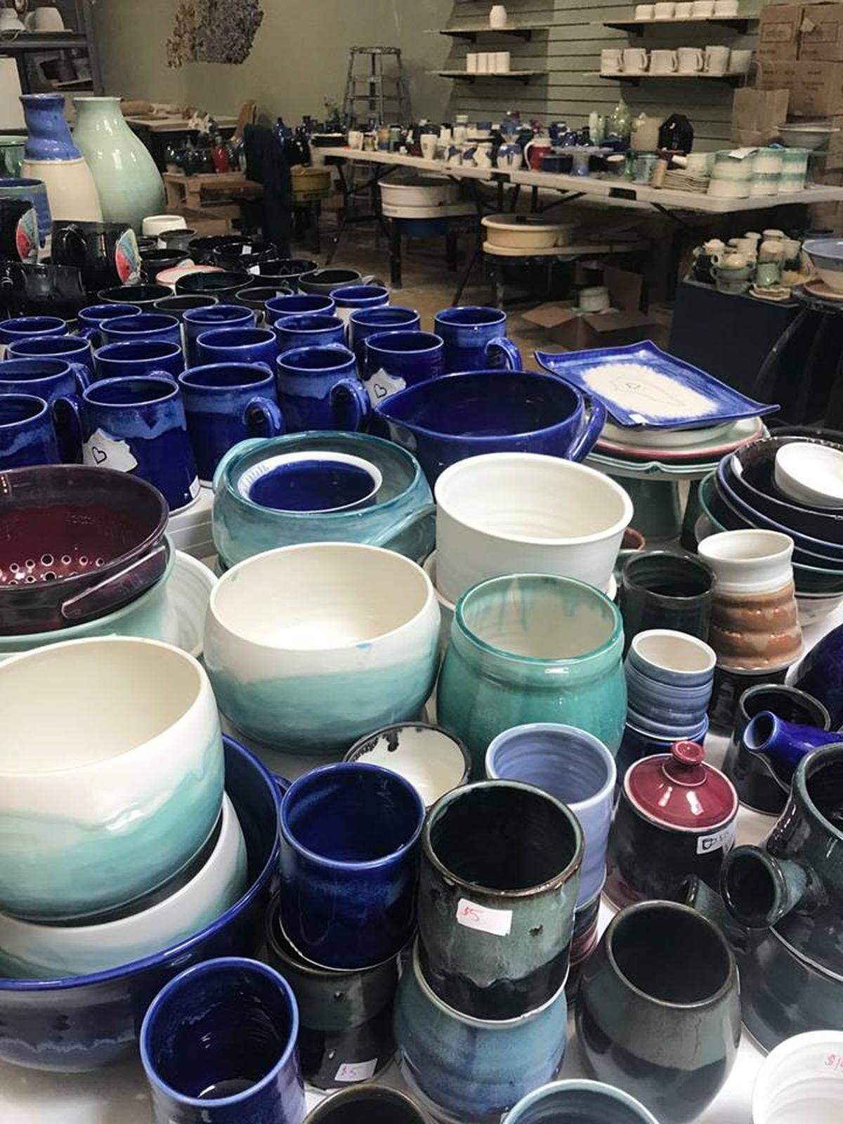 Dirty South Pottery will host an Oldies and Oopsies sale on Saturday including items with glazing flaw, warps, and cracks. Pictured is a table of the pottery including bowls and mugs.