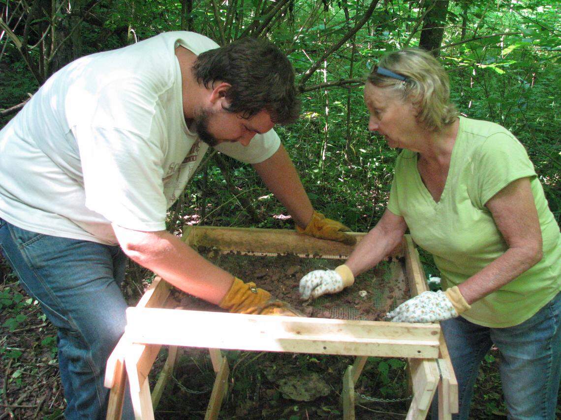 Volunteers Jack Wright, left, of Warsaw and Gail Combs of Versailles sifted for artifacts from an archaeological site in southern  Woodford County. The area is thought to be the early 19th-century site of Revolutionary War hero Jack Jouett's mill and distillery.   