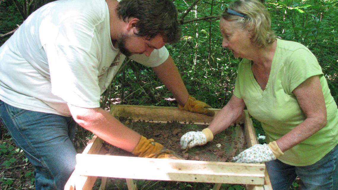 Volunteers Jack Wright, left, of Warsaw and Gail Combs of Versailles sifted for artifacts from an archaeological site in southern  Woodford County. The area is thought to be the early 19th-century site of Revolutionary War hero Jack Jouett's mill and distillery.   