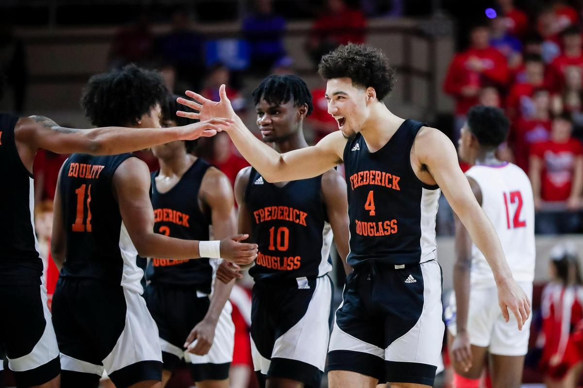 Frederick Douglass’ Kai Simpson (4) celebrates scoring a basket against Madison Central during the 11th Region Tournament semifinals in Richmond on Saturday.