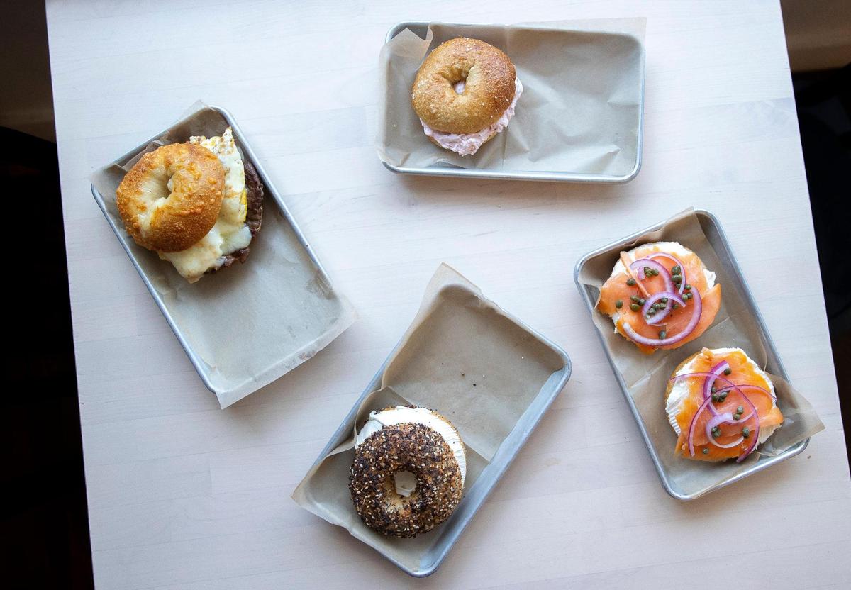 Clockwise from top left: Native Bagel’s sausage, egg and cheese bagel, salt bagel with strawberry cream cheese, lox bagel and everything bagel with regular cream cheese.