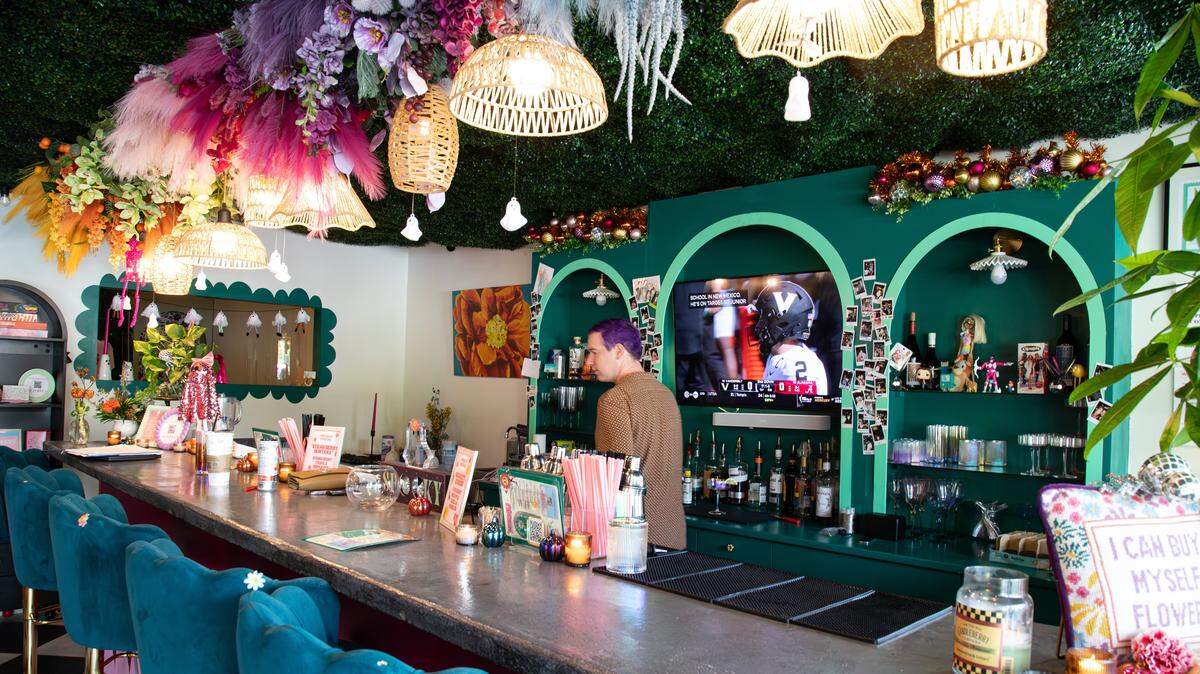 Bartender Jake Terry serves clients alcoholic beverages, cocktails, and colorful moctails at Poppy’s Flower Bar during private events and while building bouquets on Oct. 4, 2025, in Lexington, Ky.
