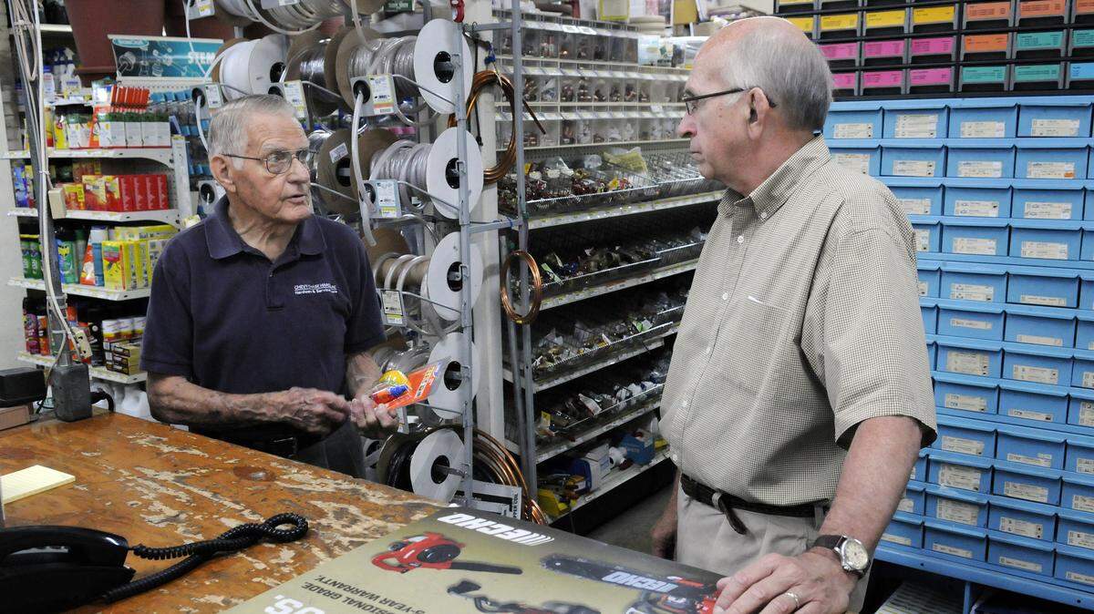 Chevy Chase Hardware employee Luther Hilliard, left, discussed merchandise with owner Bill Edwards. Edwards says his store is now the last of its kind in town.
