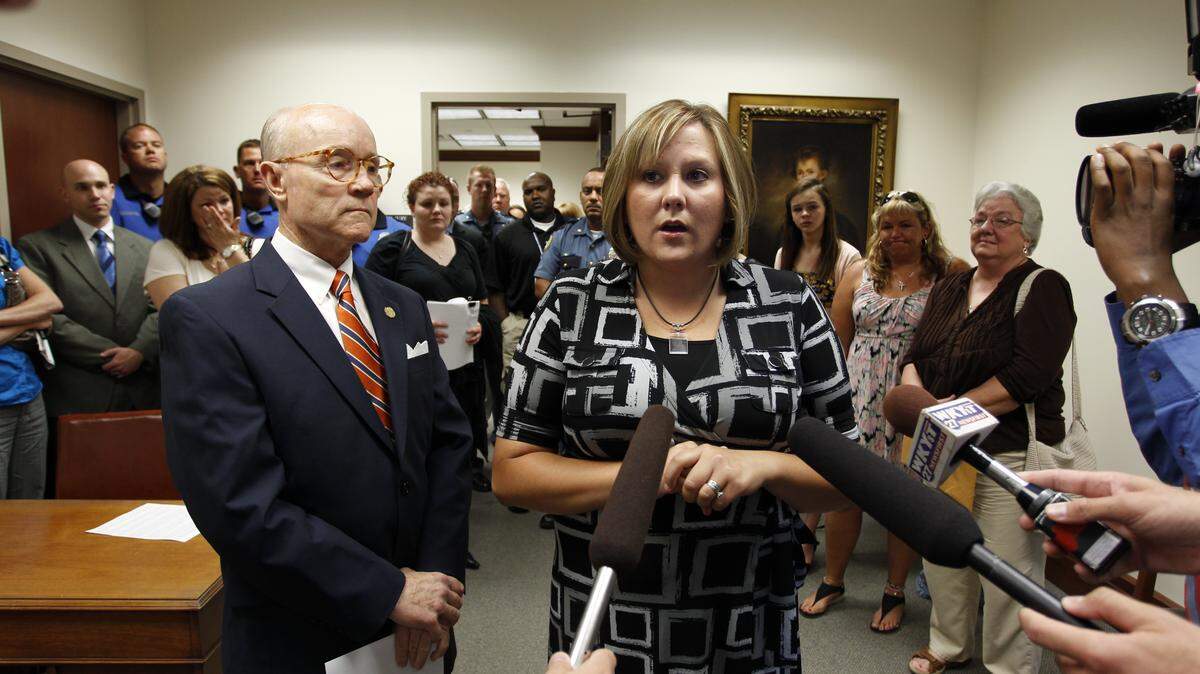Brandy Durman, widow of Bryan Durman, with Commonwealth's Attorney Ray Larson, left, addressed the media after Glenn Doneghy was sentenced in Fayette Circuit Court on Friday. See a photo gallery from the Doneghy case at Kentucky.com.  