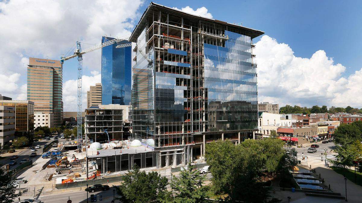 Construction workers continued installing glass panels at the One City Center office tower under construction at the corner of West Vine Street and South Limestone. Webb Companies Project Coordinator Ralph Coldiron said 4,222 pieces of glass will be needed to wrap the building.