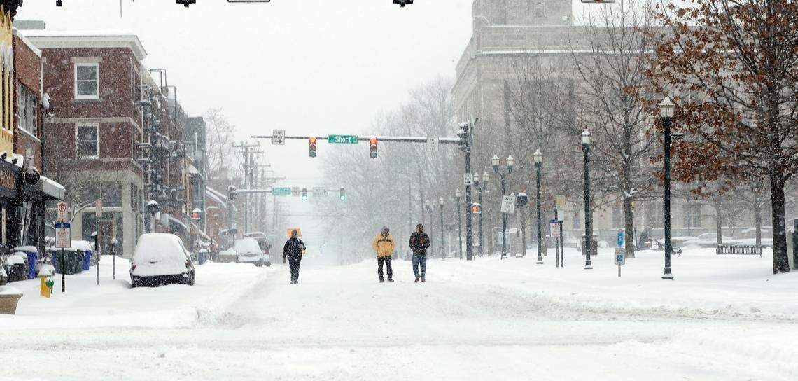 Three men walked in the middle of North Limestone near East Main Street in Lexington, Ky., Thursday, March 5, 2015. 