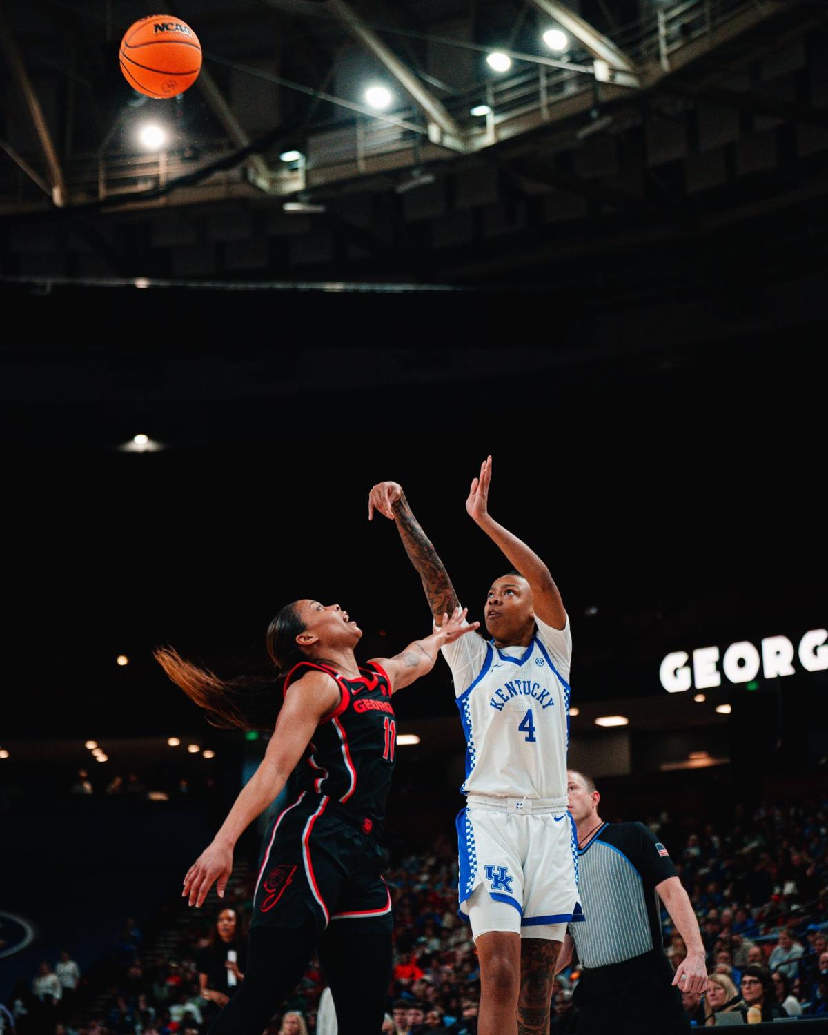 Eniya Russell (4) provided a spark off the bench during Kentucky’s Southeastern Conference Tournament opener against Georgia at Greenville, South Carolina, on Wednesday. Russell led Kentucky with 19 points.