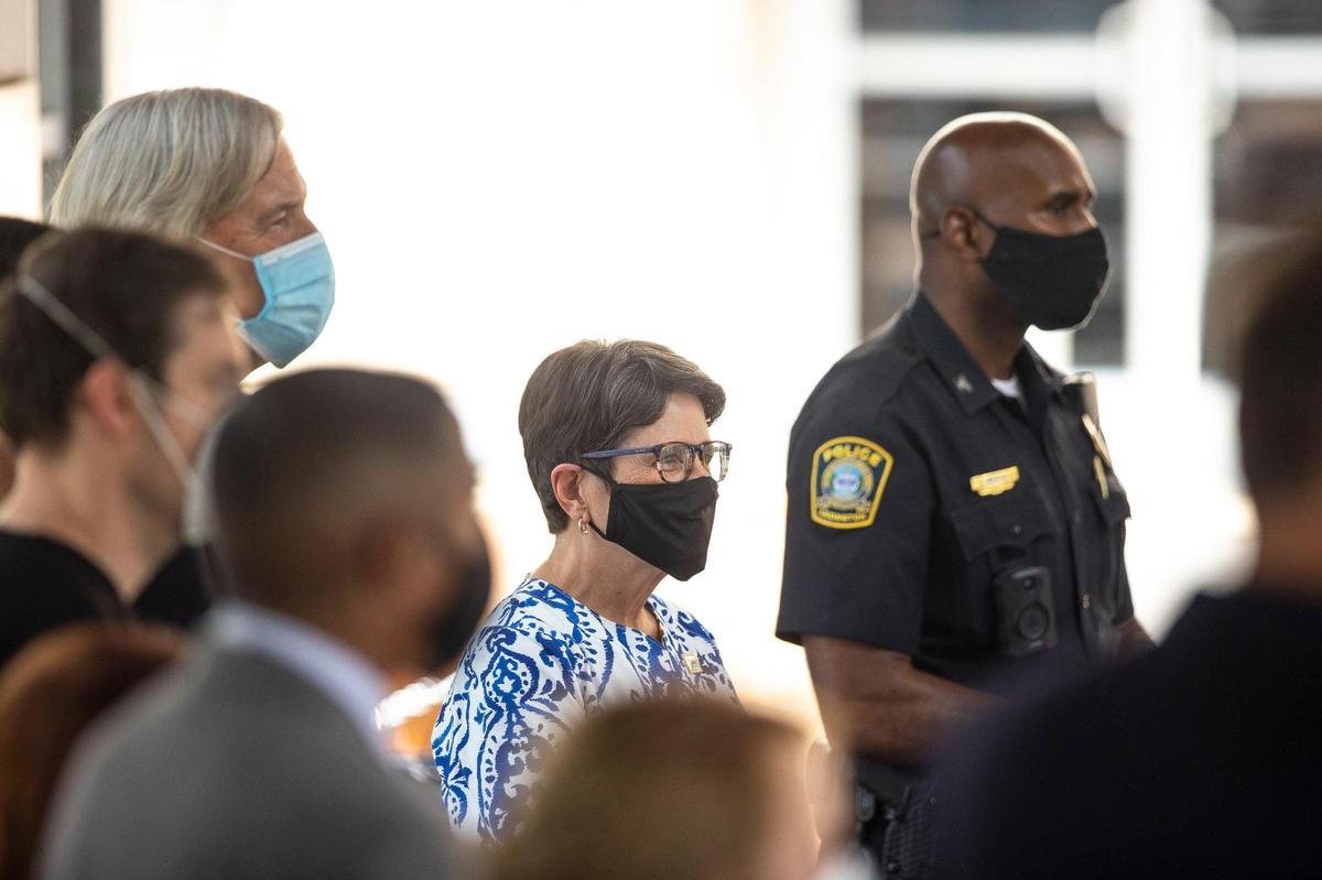 Lexington Mayor Linda Gorton, center, is surrounded by members of the healthcare stakeholders group during a media conference on the COVID-19 surge in the community held at the Fifth/Third Pavilion in Lexington, Ky., on Tuesday, Aug. 24, 2021.