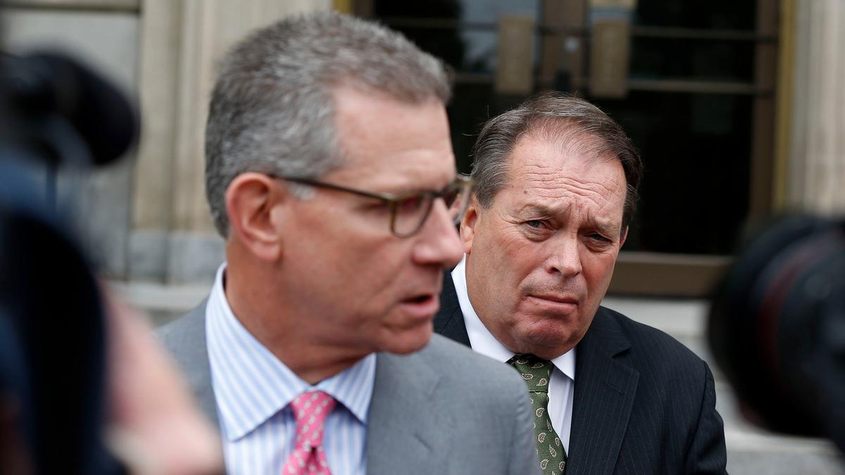 Jerry Lundergan, back, listened as his attorney, J. Guthrie True, spoke to the media following Lundergan’s first U.S. District Court appearance Wednesday morning on campaign finance charges.