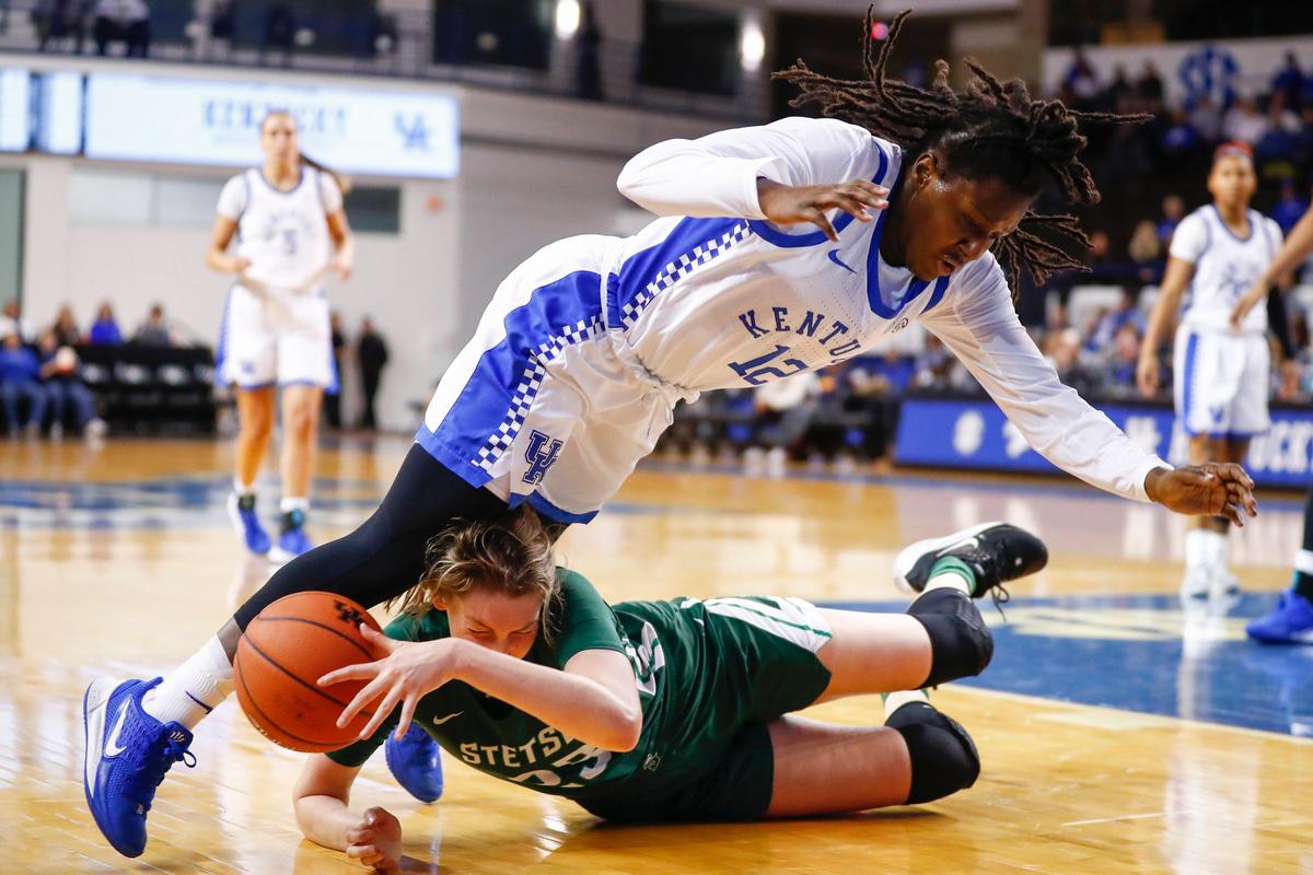 Kentucky guard Amanda Paschal (12) tripped over Stetson forward Megan Vincent.