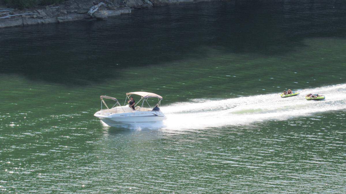 A boat pulled two rafts on Lake Cumberland in May 2023.