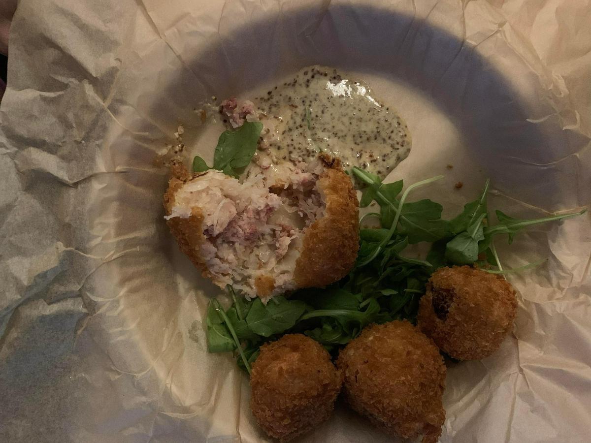Another Nightjar appetizer: Sauerkraut Fritters, mild sauerkraut bundled with Swiss cheese and speckwurst sausage and served with honey mustard.