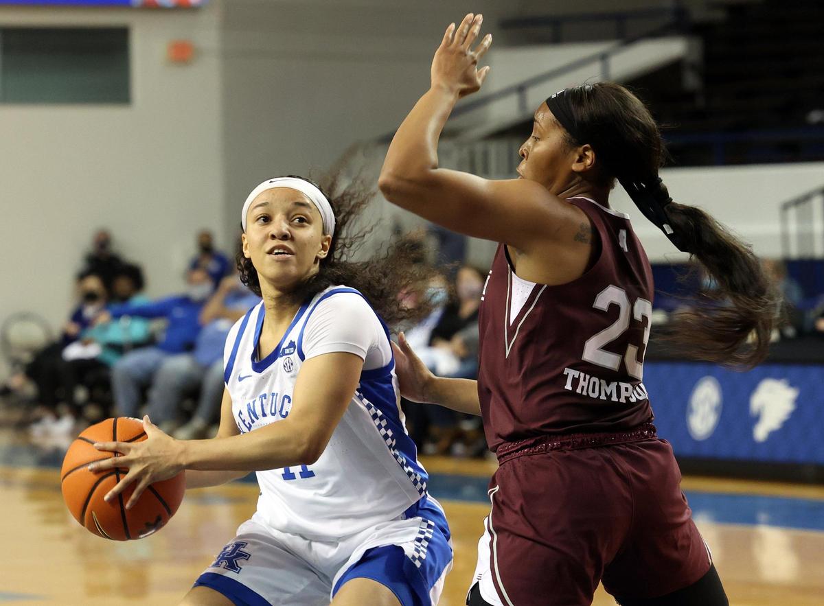 Kentucky’s Jada Walker, left, is pressured by Mississippi State’s Caterrion Thompson (23) in Memorial Coliseum on Tuesday night. Walker, a freshman, finished with 17 points.