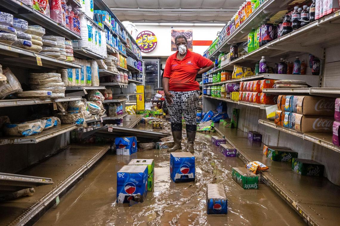 Gwen Christon stands in an aisle at the Isom IGA in Isom, Ky., on Monday, Aug. 1, 2022. Christon began working at the store as a cashier months after it first opened in 1973. She now owns the store with her husband, Arthur. Last week, historic floods ravaged the store.