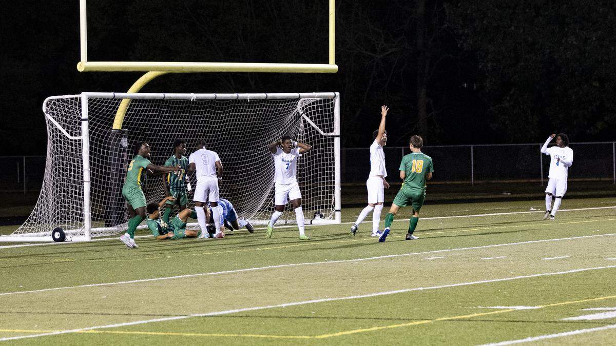 Henry Clay’s Shukuru Hamisi (7) reacted as Bryan Station goalkeeper Luke Majors and center back Joaquin Guerrant (both on ground) stopped Espoir Dieudonne’s (9) shot late in the second half of the 11th Region boys soccer tournament championship game at Paul Laurence Dunbar High School on Friday.