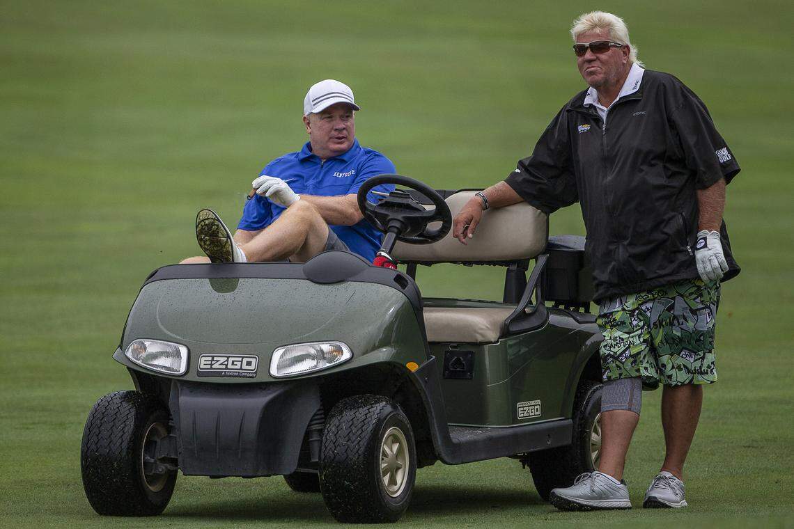 University of Kentucky head football coach Mark Stoops, left, chats with golfer John Daly during the PGA Barbasol Championship pro-am at Champions at Keene Trace Golf Club in Nicholasville Wednesday, July 17, 2019.