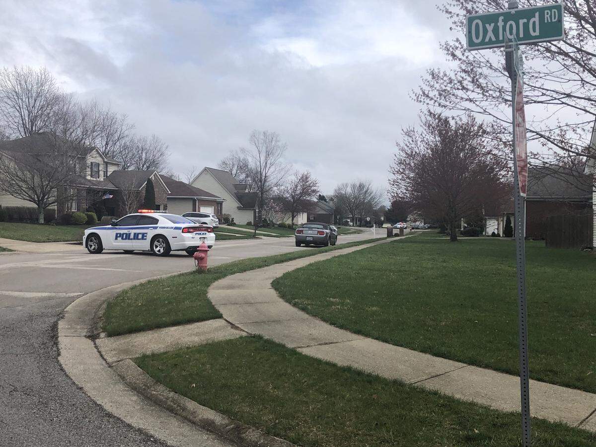 Versailles police have blocked off a section of a street in a Versailles neighborhood around an address listed in public records as connected to the suspect arrested Thursday at UK.