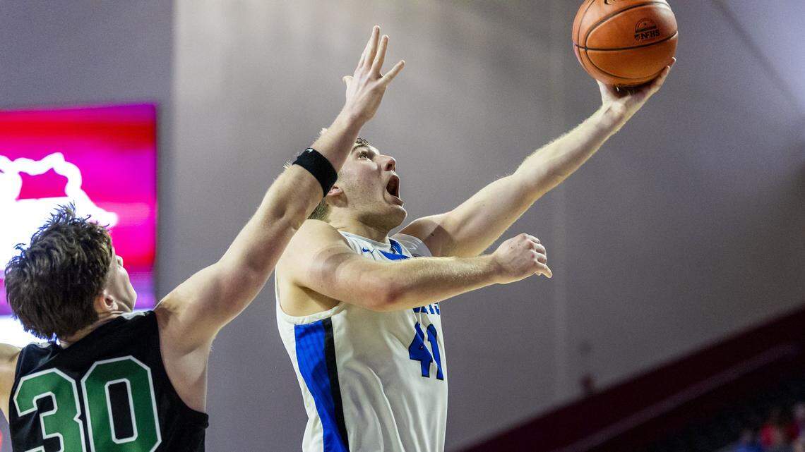 Lexington Catholic's Hank Woodall (41) makes the game-winning basket with 3.9 seconds left during the Knights 42-41 win over the Defenders in the quarterfinals of the boys basketball 11th Region Tournament, Wednesday, March 4, 2026 at Eastern Kentucky University's Baptist Health Arena in Richmond, Ky.