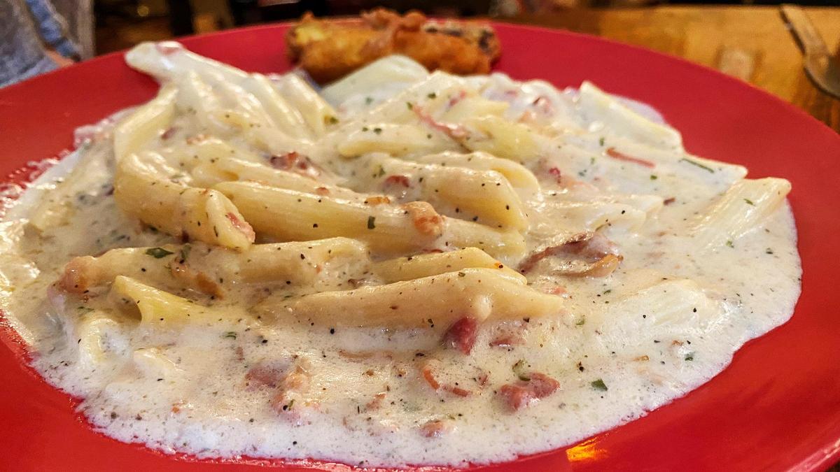 Penne Carbonara at Paisano’s Italian Restaurant & Lounge is cooked with bacon and a three-cheese cream sauce.