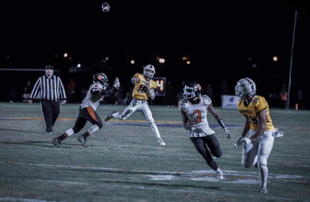 Sayre quarterback Luke Pennington finds Grant Barnsten for a touchdown late in the third quarter, his fifth TD pass of the night, as the Spartans defeated visiting Paris.