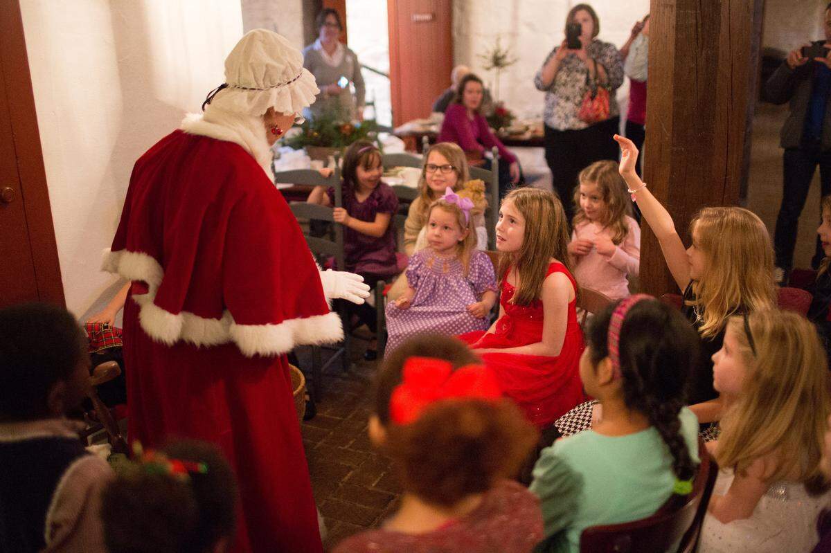 Mrs. Claus reads to kids and enjoys tea at Shaker Village Of Pleasant Hill this weekend.