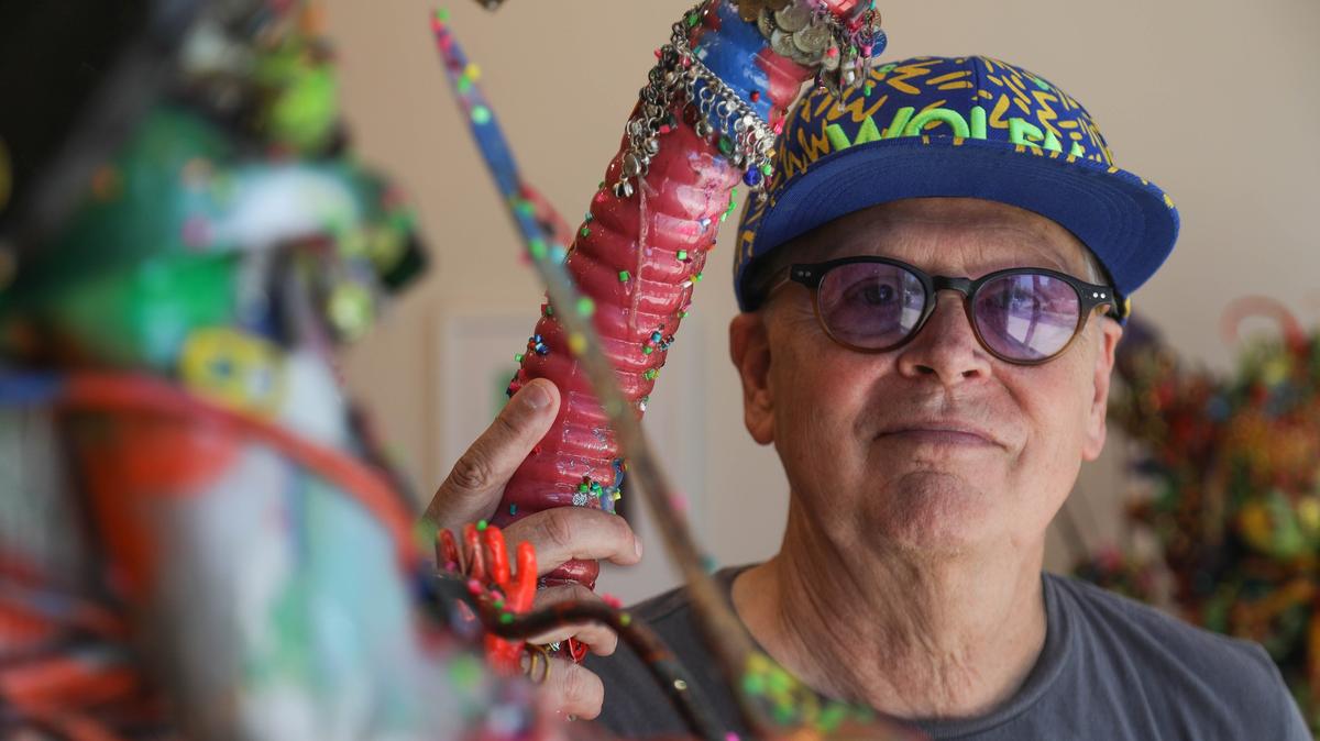 Robert Morgan stands behind one of his found object sculptures at the the Pam Miller Downtown Arts Center.