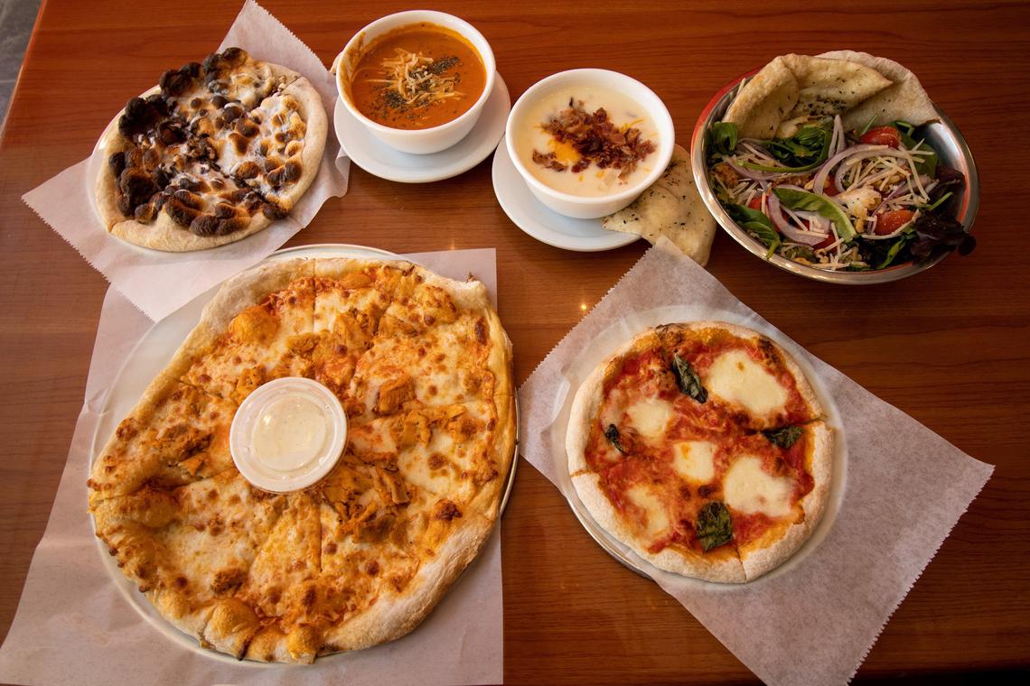 Clockwise from top: a S’Mores Pizza; homemade Tomato Basil Bisque and Loaded Baked Potato soup; Chopped House Salad; Margherita Pizza and a Buffalo Chicken Ranch Pizza .