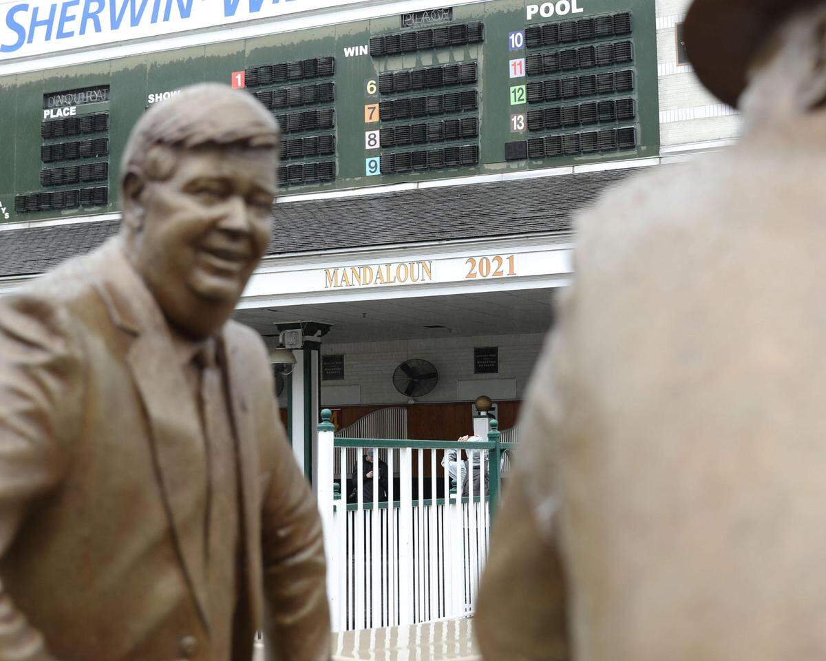 A sign recognizing Mandaloun as the winner of the 2021 Kentucky Derby was installed at Churchill Downs in Louisville on Tuesday.